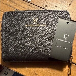 Black Zip-Around Pebbled Leather Wallet with Gold Hardware